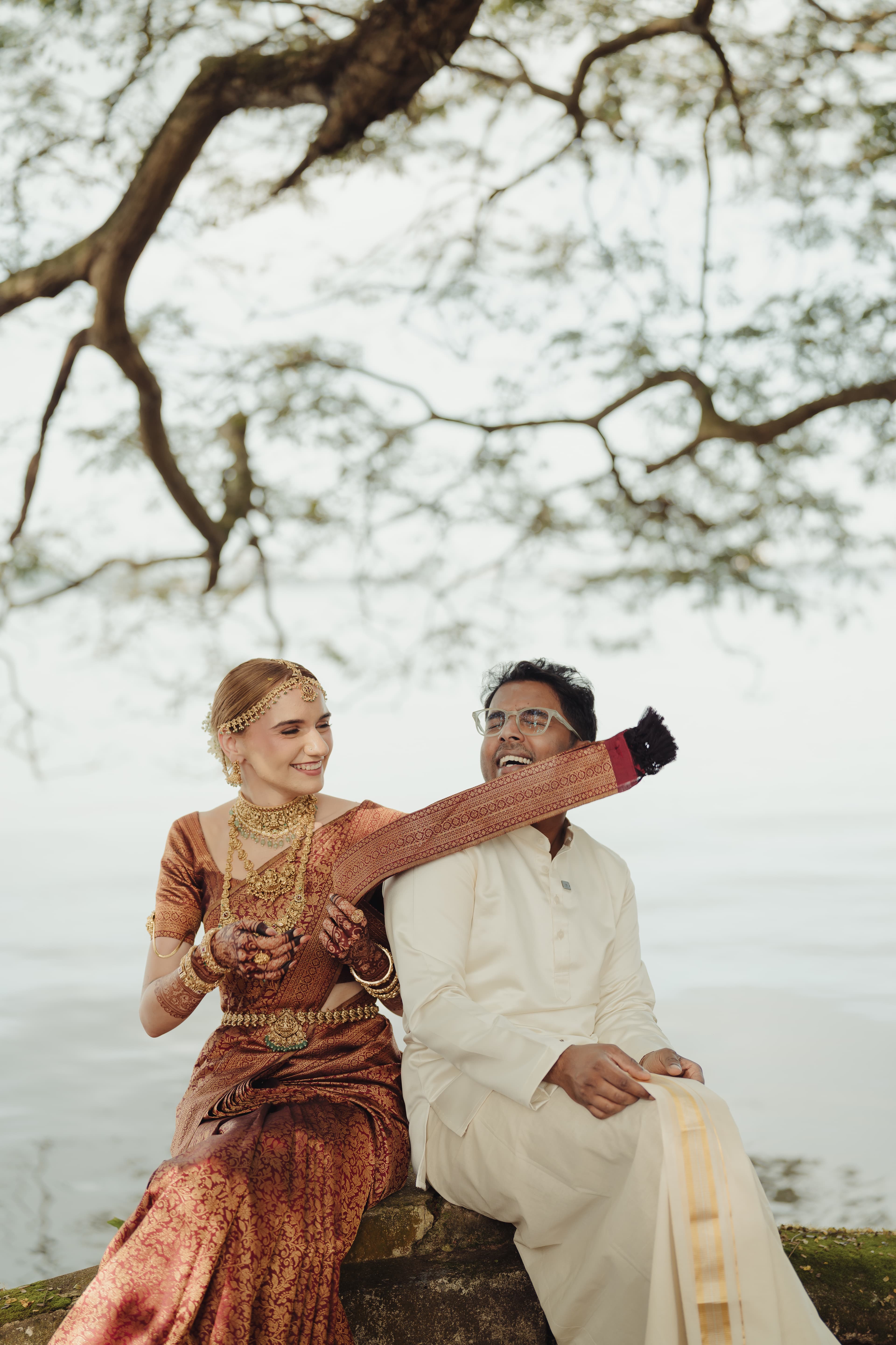 Couple posing happily after their Christian wedding in Kochi, India